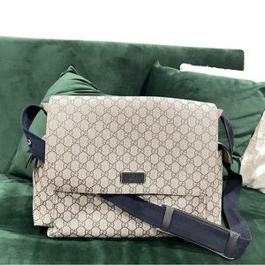 Gucci GG plus diaper bag. Supreme canvas designed with multiple pockets and mat